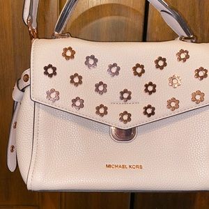 Pink Michael Kors purse with rose gold accents
